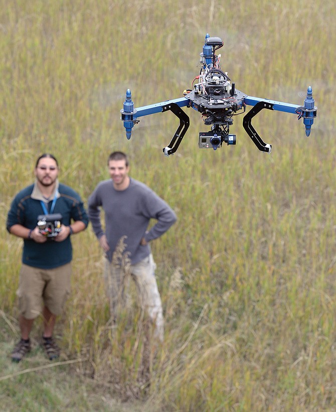 Yoshi Yonekawa, left, a videographer with KPA Productions pilots a professional quad-copter drone while standing next to KPA owner Kelly Anzalone. Drones have surged in popularity over the last few years, and commercial use of the devices is currently banned by the Federal Aviation Administration. 